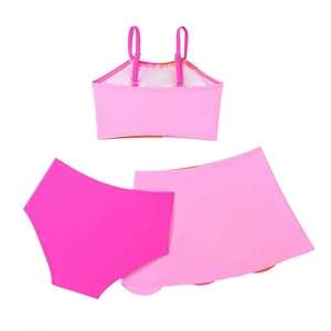Detailed flat lay of a girls' 3-piece swimsuit with pink tank top, skirt, and bottoms