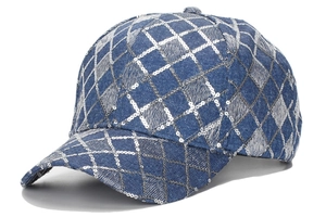 Detailed view of blue denim baseball cap featuring a silver sequin diamond grid design