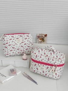 Quilted floral makeup bag set with zipper pouch and pink flower pattern details