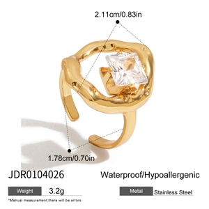 Gold stainless steel ring featuring irregular lines and a large square zircon stone