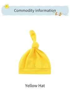 Detailed view of yellow knotted newborn beanie made of soft breathable knitted cotton