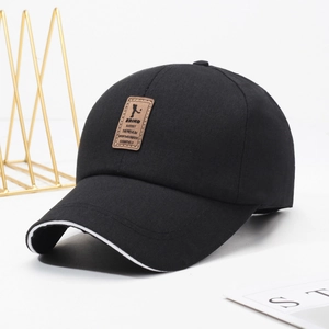 Classic black cotton baseball cap with white sandwich brim and brown leather patch