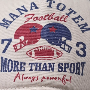 Retro washed denim baseball cap featuring vintage football helmet prints and lettering