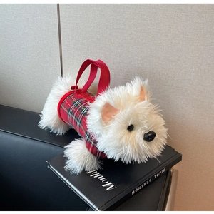 Detail of Westie dog plush bag featuring a red tartan vest and red handle strap