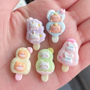 Close-up of colorful resin cartoon animal ice cream charms for DIY crafts and accessories