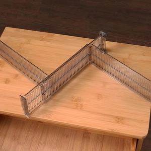 Adjustable transparent brown drawer dividers for organizing clothes and home essentials