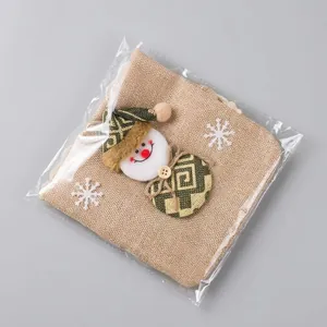 Christmas burlap wine bag with snowman pattern, showing 16cm width with a ruler scale