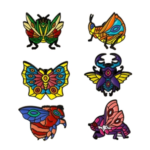 Set of 6 colorful enamel insect pins featuring butterfly beetle and bee designs on metal
