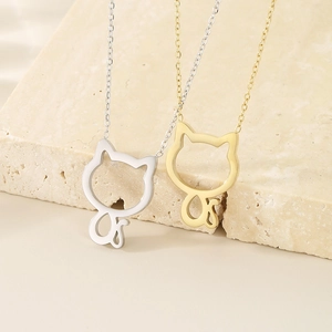Minimalist hollow cat pendant necklaces in gold and silver finish on textured stone
