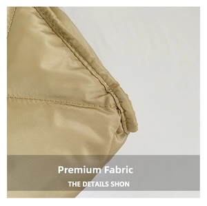 Macro detail of quilted beige nylon fabric with premium stitching on underarm bag