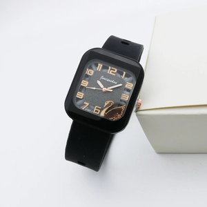 Square black quartz watch with rose gold swan motif and flexible silicone strap