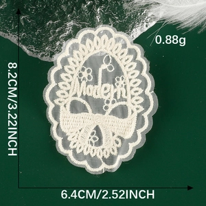 Close-up of white lace bow patch with Modern embroidery and dimensions 8.2cm x 6.4cm