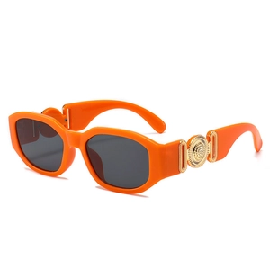 Retro small frame orange sunglasses with thick polygonal frame and gold metal accents