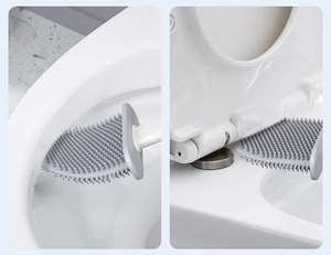 Flexible grey silicone toilet brush head bending to clean difficult bathroom corners