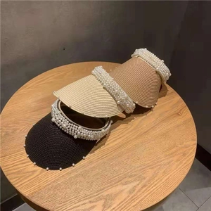 Three-piece set of woven straw sun visors with pearl accents in black, beige, and coffee