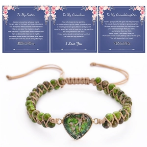Macro detail of handmade heart-shaped emperor stone bracelet with message cards