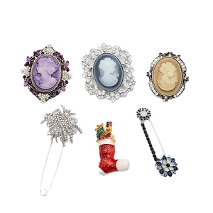 Vintage style crystal rhinestone brooches set with portrait relief and floral designs