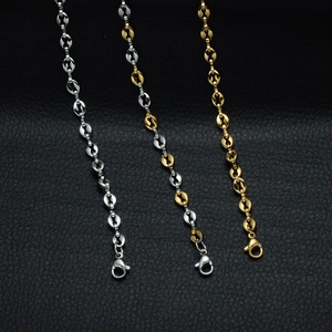 Detailed macro view of 5mm stainless steel coffee bean chain links with lobster clasps