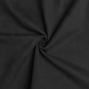 Macro shot of soft black faux suede fabric texture with elegant vortex folds and draping