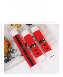 Detail of red flannel Santa belt refrigerator handle covers with white plush trim