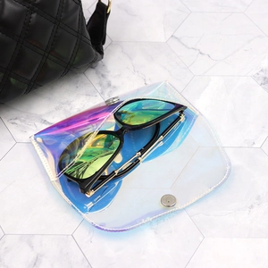 Detail of holographic PVC eyewear case with silver metal snap and large sunglasses