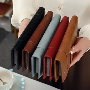 Elegant long leather bifold wallets for women in five colors held by hands
