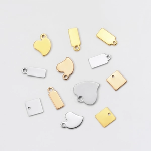 Polished stainless steel heart and geometric pendants in gold and silver finishes
