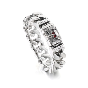 Retro punk silver steel Cuban chain bracelet featuring pirate skull with red stone eyes