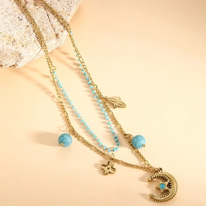 Double-layered gold titanium steel necklace with star, moon pendants and blue beads