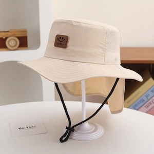Detail of beige kids sun hat showing breathable mesh, neck flap and Lucky leather patch