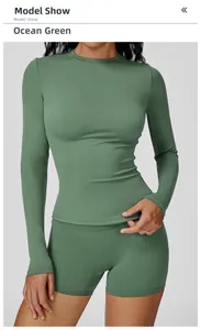 Close-up of Seaweed Green brushed yoga top and shorts showing elastic fabric texture