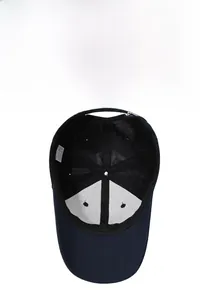 Detail view of cotton baseball cap interior showing breathable mesh and adjustable silver buckle