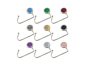 Grid display of nine colorful metal desk bag hooks with round textured tops in various finishes