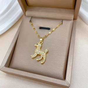 Elegant gold-plated poodle necklace with sparkling crystals in a luxury jewelry box