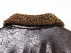 Detail of vintage faux leather jacket with faux shearling collar and premium double stitching