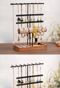 Macro detail of jewelry stand featuring earring hooks and velvet bracelet bars