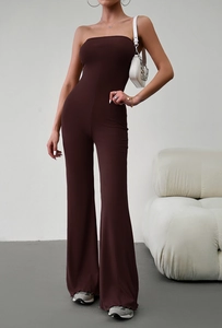 Detail view of dark brown ribbed tube top jumpsuit with elegant ruffled leg hem