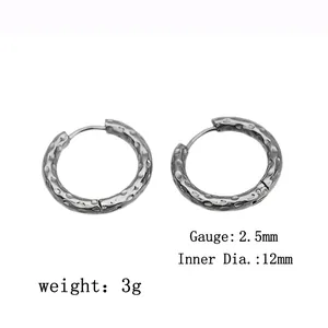 Detail view of silver hammer texture earrings with 2.5mm width and 12mm diameter