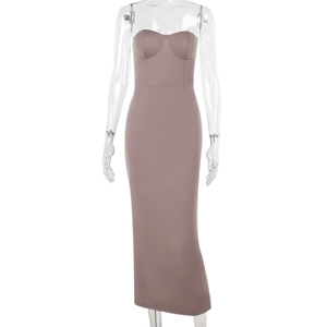 Detail of taupe strapless knitted maxi dress with slim fit on a white background