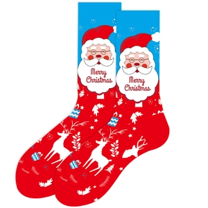 Detail of red and blue Christmas socks with Santa Claus, elk patterns and Merry Christmas text