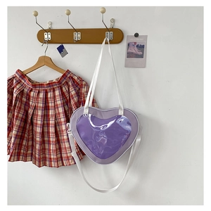 Detail of purple heart ita bag with transparent PVC window on a wooden hanger with JK skirt