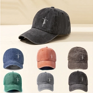 Multiple colors of washed cotton baseball caps featuring Faith embroidery and cross design