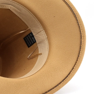 Detail view of cotton-polyester blend hat label showing material composition and stitching