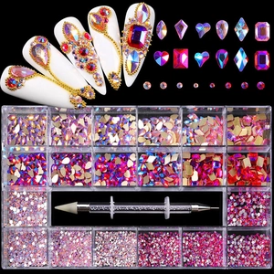 Macro detail of 21-grid nail art rhinestones set with dual-ended picker dotting pen tool