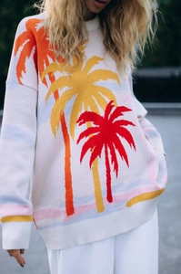Detail of coconut tree jacquard pattern on a loose knit oversized sweater for women