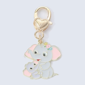 Detail of enamel elephant pendant with golden heart spring clasp and metal ring