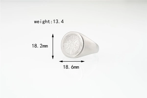 Detailed macro view of octagram star compass engraving on matte stainless steel ring