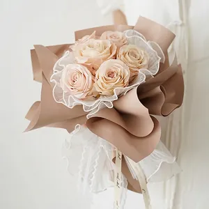 Korean style champagne rose bouquet with decorative white wave lace mesh wrapping fabric