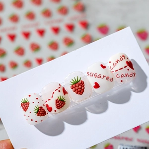 Adhesive nail stickers featuring embossed raspberry, red hearts, and strawberry patterns