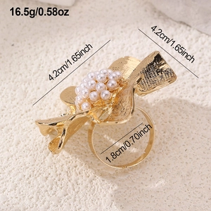 Detail view of flower ring with measurements 4.2cm diameter and 1.8cm inner ring size